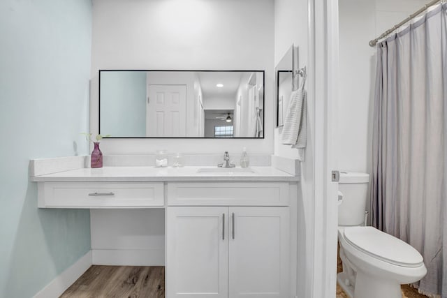 10164 40th Way S Unit 256, Boynton Beach, FL 33436 - bathroom featuring vanity, toilet, shower / bath combo with shower curtain, and wood finished floors