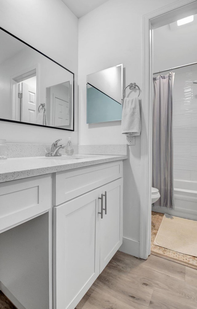 10164 40th Way S Unit 256, Boynton Beach, FL 33436 - bathroom featuring vanity, toilet, shower / bath combo with shower curtain, and wood finished floors