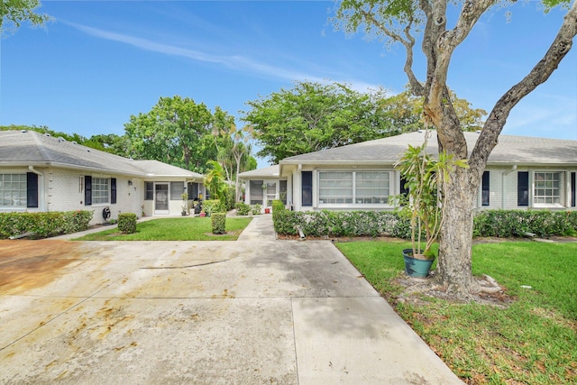 10164 40th Way S Unit 256, Boynton Beach, FL 33436 - view of front facade with a front yard and brick siding