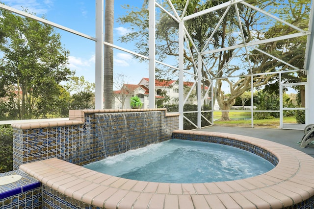 view of swimming pool featuring glass enclosure