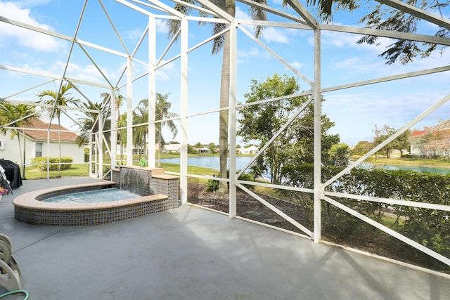 sunroom with a water view and a hot tub