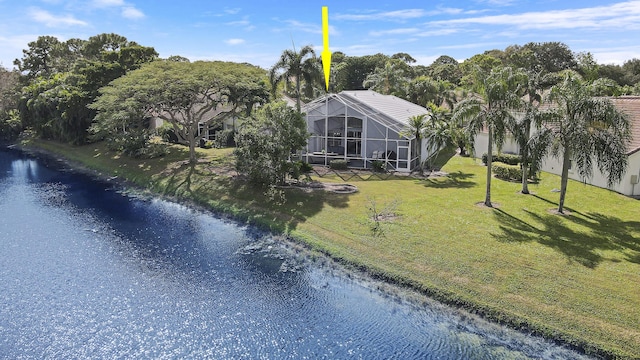 aerial view of property and surrounding area with a nearby body of water