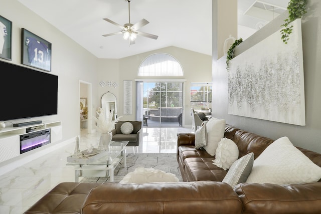 living room with high vaulted ceiling, ceiling fan, and marble finish floors