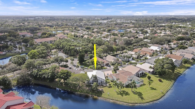 aerial view of residential area featuring a nearby body of water
