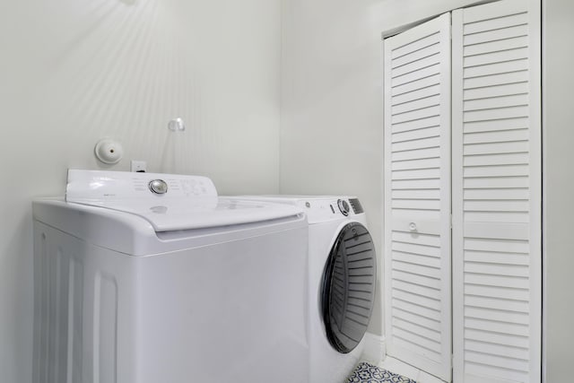 washroom featuring washer and dryer and tile patterned floors
