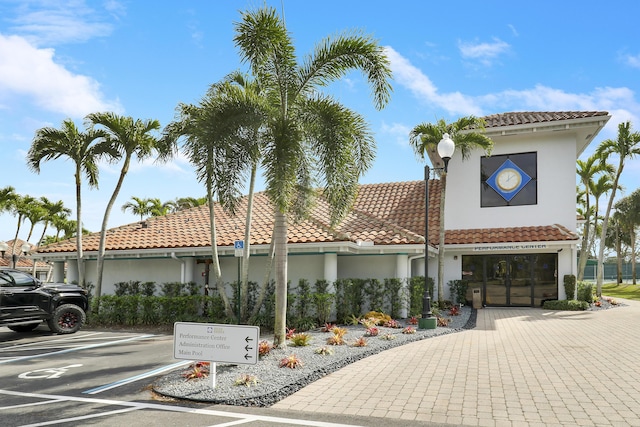 view of property featuring uncovered parking