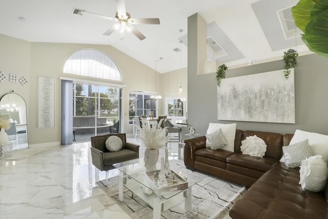 living room featuring a chandelier, marble tiled flooring, high vaulted ceiling, and ceiling fan