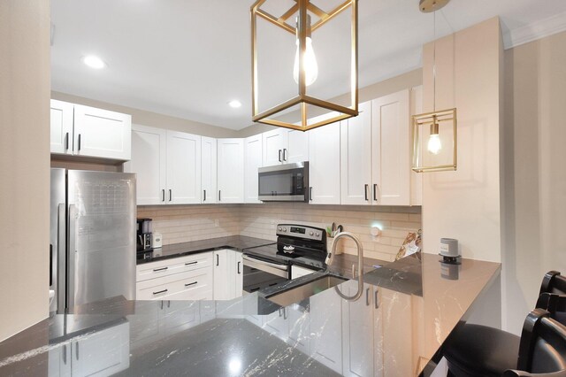 4838 Palmbrooke Cir, West Palm Beach, FL 33417 - kitchen with stainless steel appliances, a sink, dark stone countertops, decorative backsplash, and recessed lighting