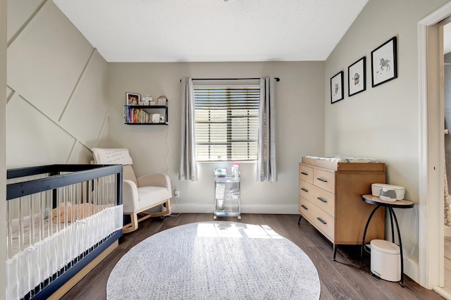 4838 Palmbrooke Cir, West Palm Beach, FL 33417 - bedroom with wood finished floors, baseboards, and a crib