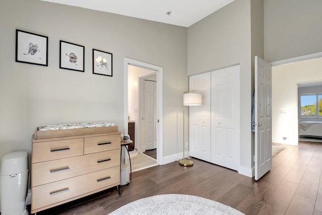 4838 Palmbrooke Cir, West Palm Beach, FL 33417 - bedroom with dark wood-type flooring, a closet, and baseboards