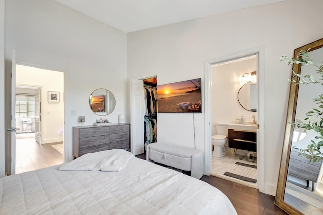 4838 Palmbrooke Cir, West Palm Beach, FL 33417 - bedroom featuring wood finished floors, a high ceiling, a walk in closet, ensuite bathroom, and a closet