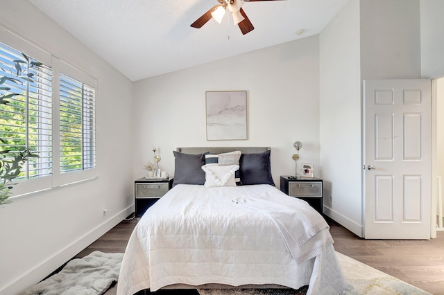 4838 Palmbrooke Cir, West Palm Beach, FL 33417 - bedroom featuring lofted ceiling, wood finished floors, baseboards, and ceiling fan