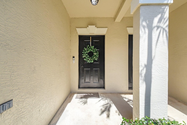 4838 Palmbrooke Cir, West Palm Beach, FL 33417 - doorway to property featuring stucco siding