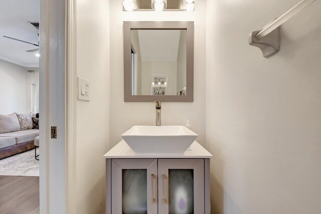 4838 Palmbrooke Cir, West Palm Beach, FL 33417 - ensuite bathroom with wood finished floors, vanity, and crown molding