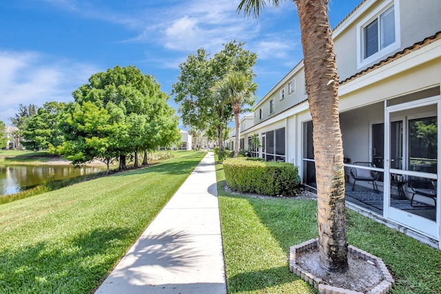 4838 Palmbrooke Cir, West Palm Beach, FL 33417 - surrounding community featuring a lawn and a water view