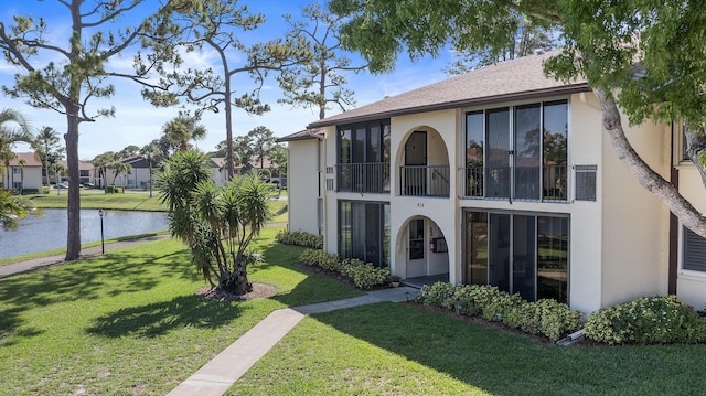 3561 Pine Tree Ct Unit A-2, Greenacres, FL 33463 - view of building exterior with a water view