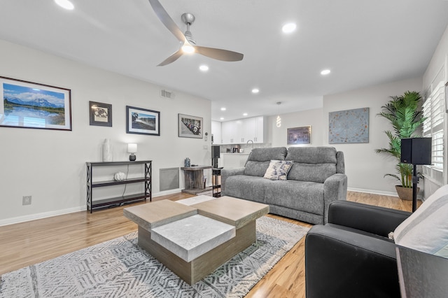 3561 Pine Tree Ct Unit A-2, Greenacres, FL 33463 - living area featuring light wood finished floors, ceiling fan, recessed lighting, and baseboards