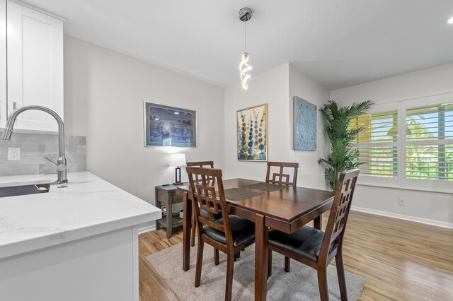 3561 Pine Tree Ct Unit A-2, Greenacres, FL 33463 - dining room with light wood-style flooring and baseboards
