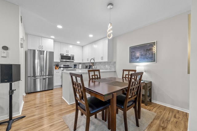 3561 Pine Tree Ct Unit A-2, Greenacres, FL 33463 - dining space with light wood-style floors, baseboards, and recessed lighting