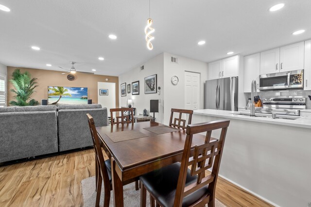 3561 Pine Tree Ct Unit A-2, Greenacres, FL 33463 - dining space featuring light wood-style flooring, ceiling fan, and recessed lighting