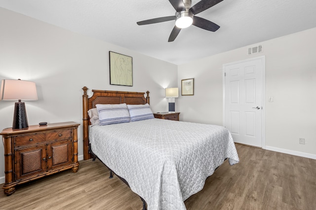 3561 Pine Tree Ct Unit A-2, Greenacres, FL 33463 - bedroom featuring wood finished floors, baseboards, and ceiling fan