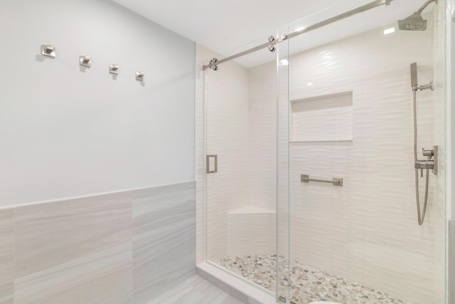400 Seasage Dr Unit 805, Delray Beach, FL 33483 - bathroom featuring tile walls and a shower stall