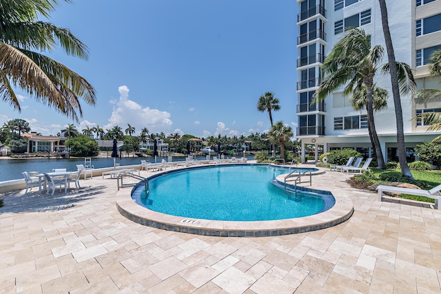 400 Seasage Dr Unit 805, Delray Beach, FL 33483 - community pool with a patio area and a water view
