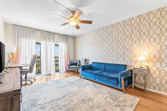 55 SW 2nd Ave Unit 405G, Boca Raton, FL 33432 - office area with wallpapered walls, ceiling fan, baseboards, an accent wall, and a textured ceiling