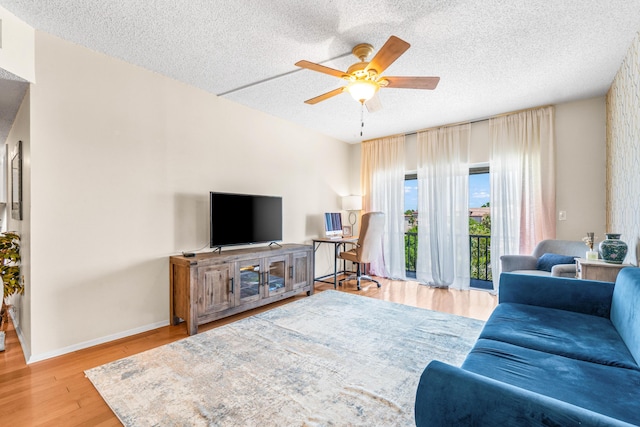 55 SW 2nd Ave Unit 405G, Boca Raton, FL 33432 - living room with a ceiling fan, a textured ceiling, wood finished floors, and baseboards