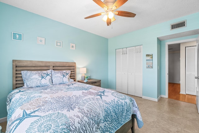 55 SW 2nd Ave Unit 405G, Boca Raton, FL 33432 - bedroom featuring a closet, baseboards, and ceiling fan