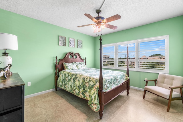 55 SW 2nd Ave Unit 405G, Boca Raton, FL 33432 - bedroom with a textured ceiling, baseboards, and ceiling fan
