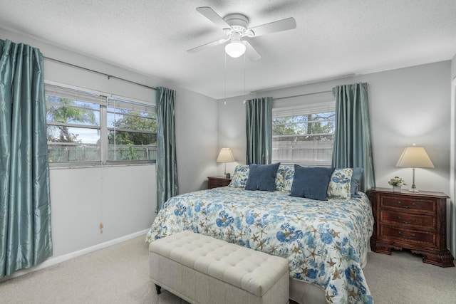 251 Grape Rd NW, Lake Placid, FL 33852 - bedroom featuring carpet flooring, a textured ceiling, ceiling fan, and baseboards
