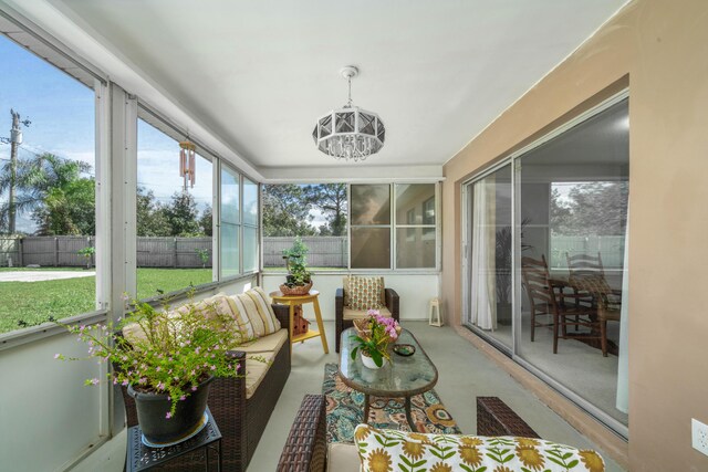 251 Grape Rd NW, Lake Placid, FL 33852 - sunroom / solarium featuring an outdoor living space and a chandelier