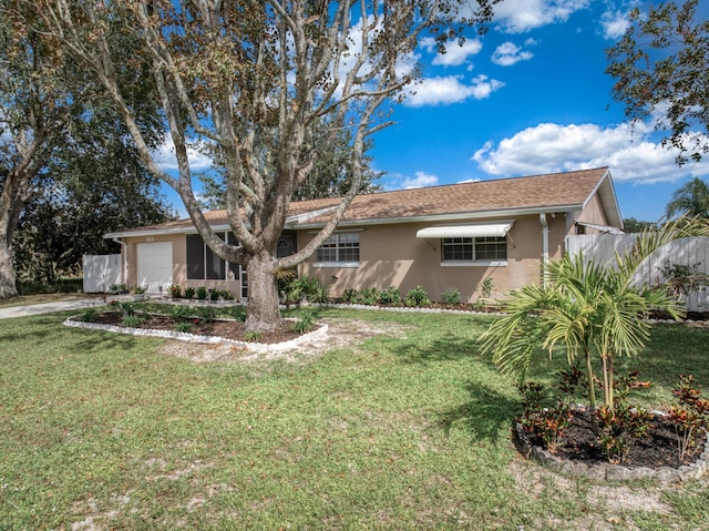 251 Grape Rd NW, Lake Placid, FL 33852 - ranch-style house with an attached garage, stucco siding, a front yard, and driveway
