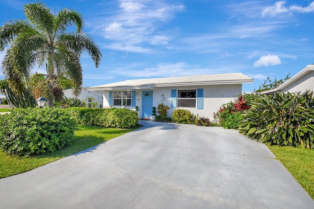 ranch-style home with stucco siding