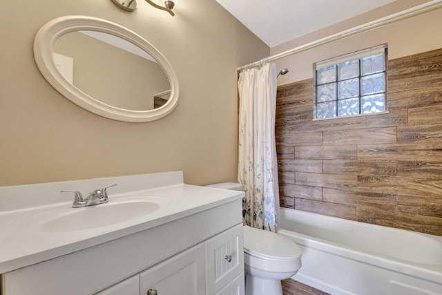 full bathroom with toilet, vanity, and shower / tub combo with curtain