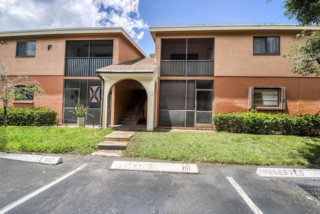 50 SE 12th St Unit 2640, Boca Raton, FL 33432 - view of building exterior with stairs and uncovered parking