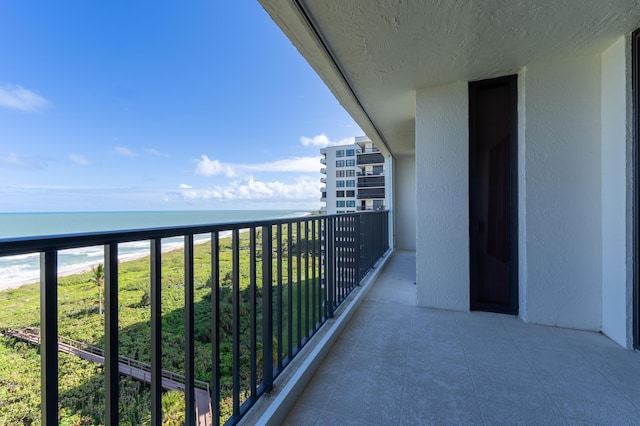 balcony featuring a water view