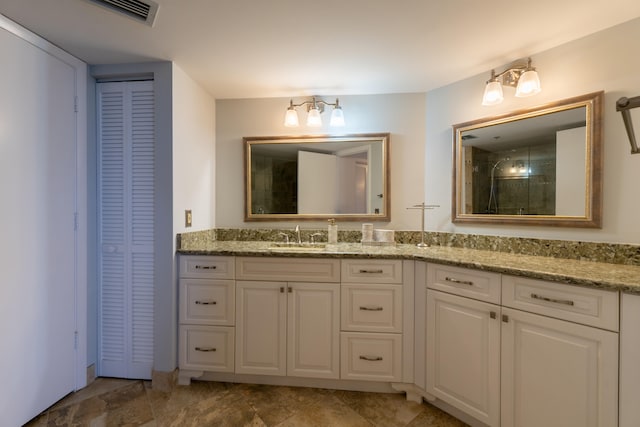 3120 N A1A Unit 1004, Hutchinson Island, FL 34949 - full bathroom with a closet, vanity, and a shower with door