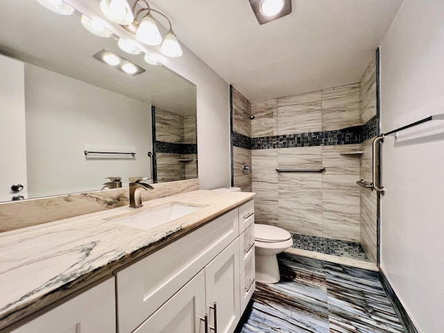 210 Somerset K, West Palm Beach, FL 33417 - bathroom with marble finish flooring, toilet, vanity, and tiled shower
