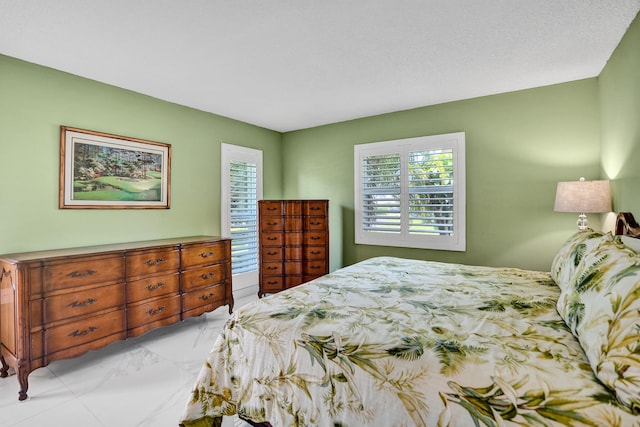 bedroom with marble finish floors
