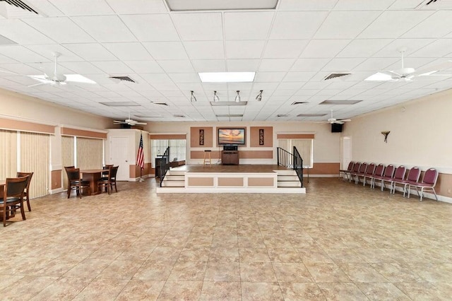 miscellaneous room with baseboards, a paneled ceiling, and ceiling fan