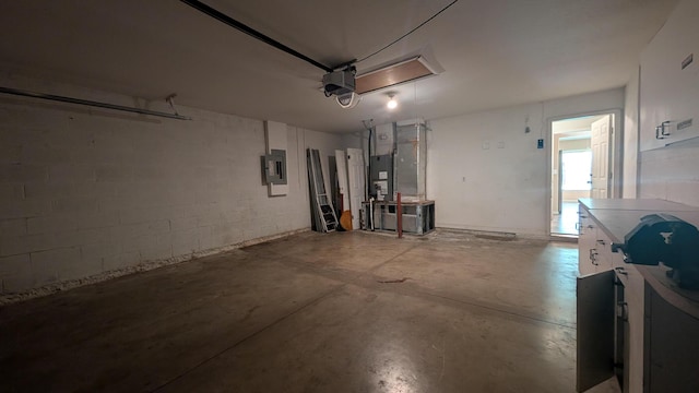 1500 SW Bermel Ave, Port Saint Lucie, FL 34953 - garage with electric panel, concrete block wall, and a garage door opener
