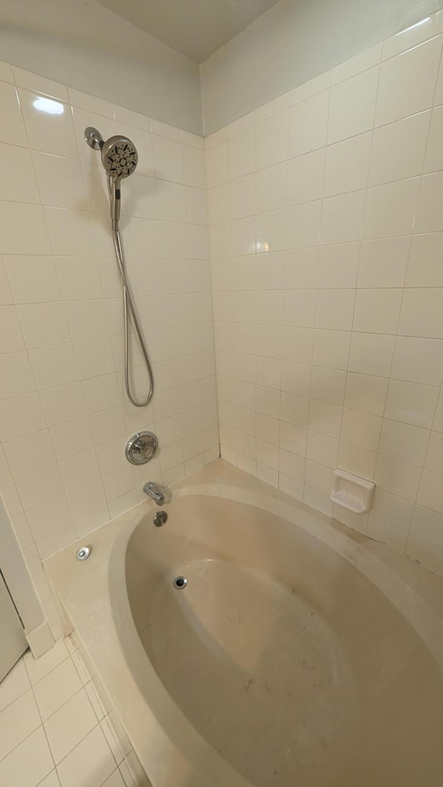 1500 SW Bermel Ave, Port Saint Lucie, FL 34953 - bathroom featuring tile patterned floors and washtub / shower combination