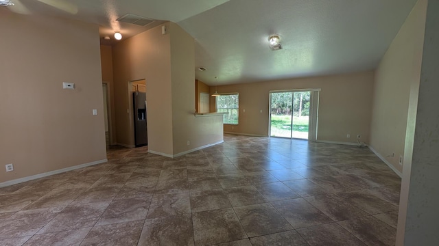 1500 SW Bermel Ave, Port Saint Lucie, FL 34953 - empty room with lofted ceiling and baseboards