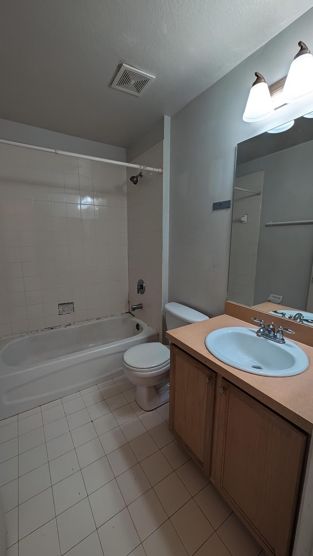 1500 SW Bermel Ave, Port Saint Lucie, FL 34953 - bathroom featuring toilet, tile patterned floors, vanity, bathtub / shower combination, and a textured ceiling