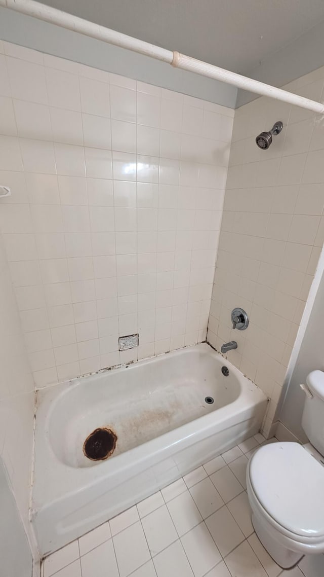 1500 SW Bermel Ave, Port Saint Lucie, FL 34953 - bathroom featuring tile patterned flooring, toilet, and bathtub / shower combination