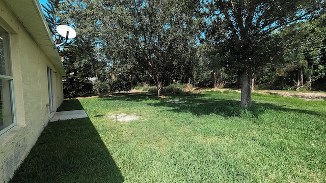 1500 SW Bermel Ave, Port Saint Lucie, FL 34953 - view of grassy yard featuring view of wooded area