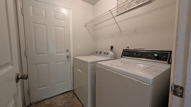 1500 SW Bermel Ave, Port Saint Lucie, FL 34953 - laundry area featuring washing machine and dryer and tile patterned flooring