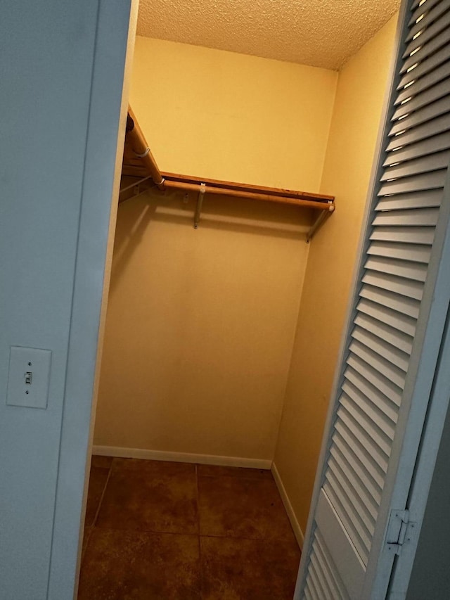 1433 SW San Esteban Ave, Port Saint Lucie, FL 34953 - walk in closet with tile patterned flooring